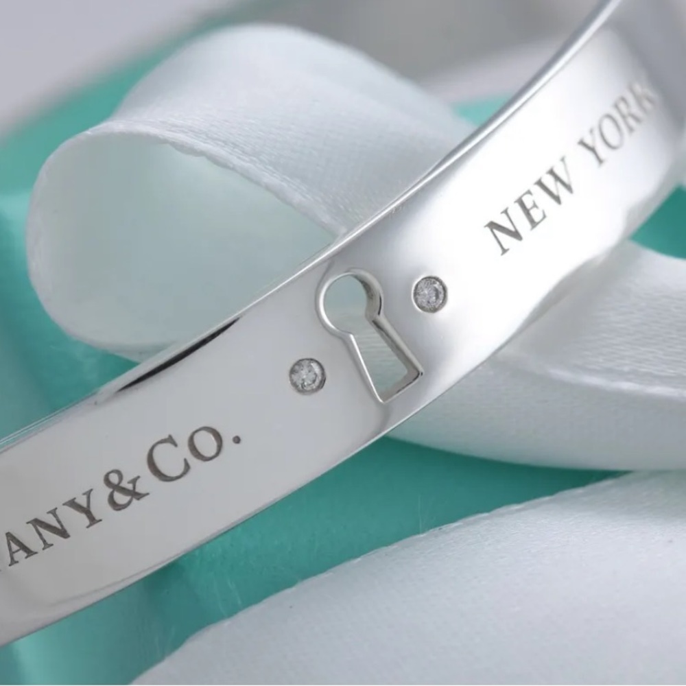 Tiffany & Co. Wide Keyhole Lock Diamond Bangle
Bracelet.